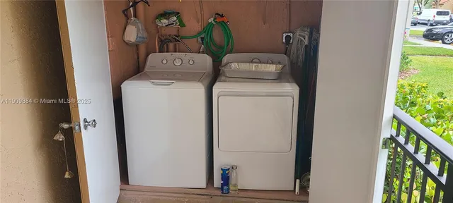 a utility room with dryer and washer