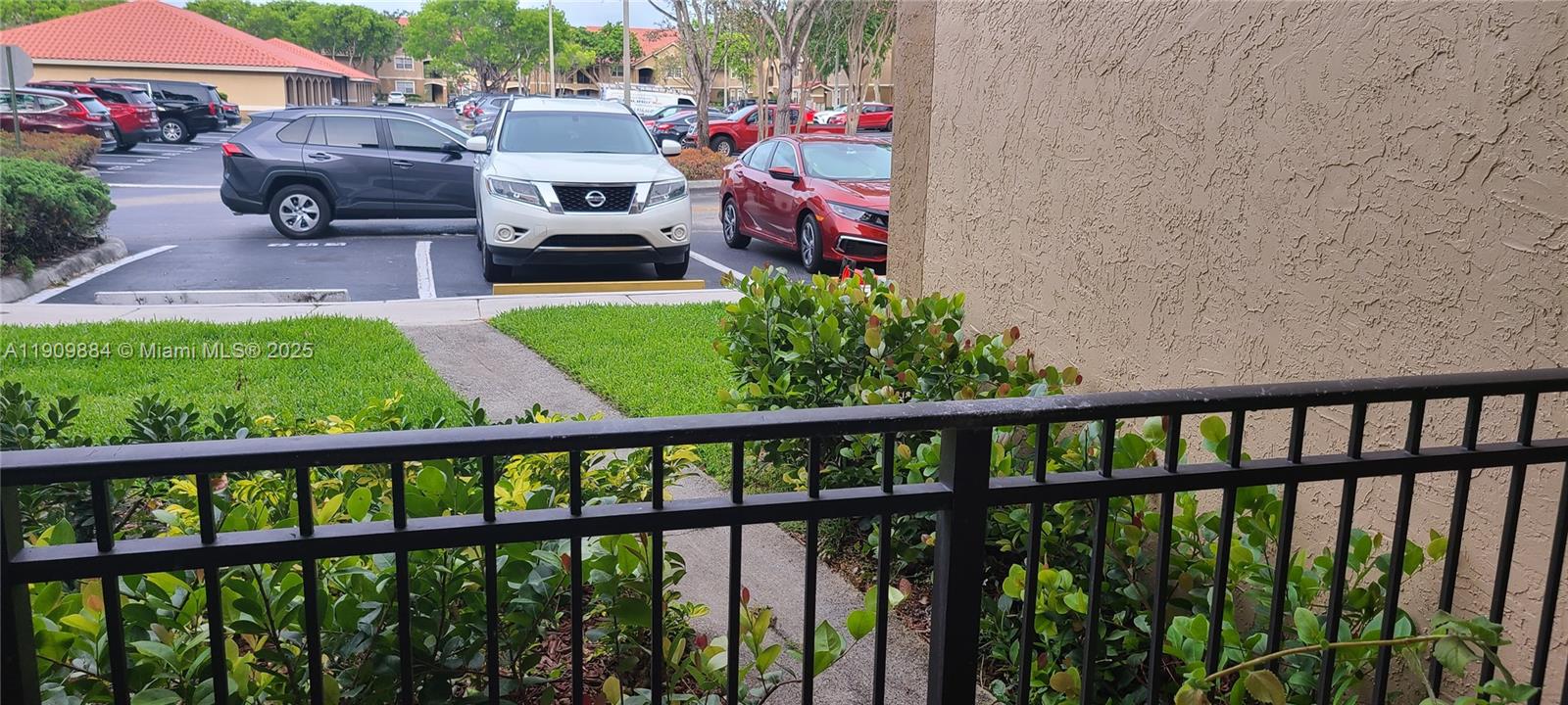 220 Southwest 116th Avenue, Unit 15103 Pembroke Pines, FL 33025 - Photo 19 of 51 a bedroom with furniture and a garden