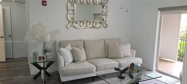 a living room with furniture and window