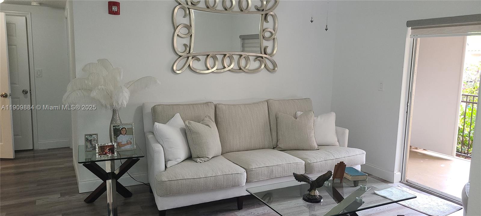 220 Southwest 116th Avenue, Unit 15103 Pembroke Pines, FL 33025 - Photo 2 of 51 a living room with furniture and window