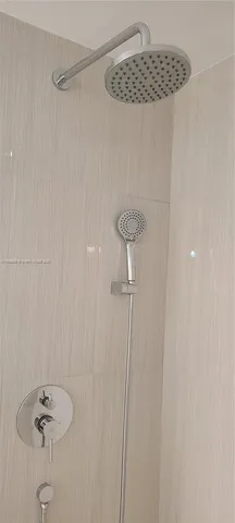 a bathroom with a sink and a shower