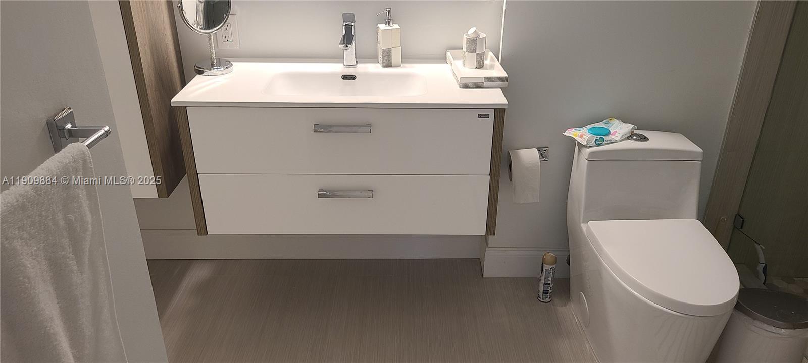 220 Southwest 116th Avenue, Unit 15103 Pembroke Pines, FL 33025 - Photo 30 of 51 a bathroom with a sink toilet and a mirror