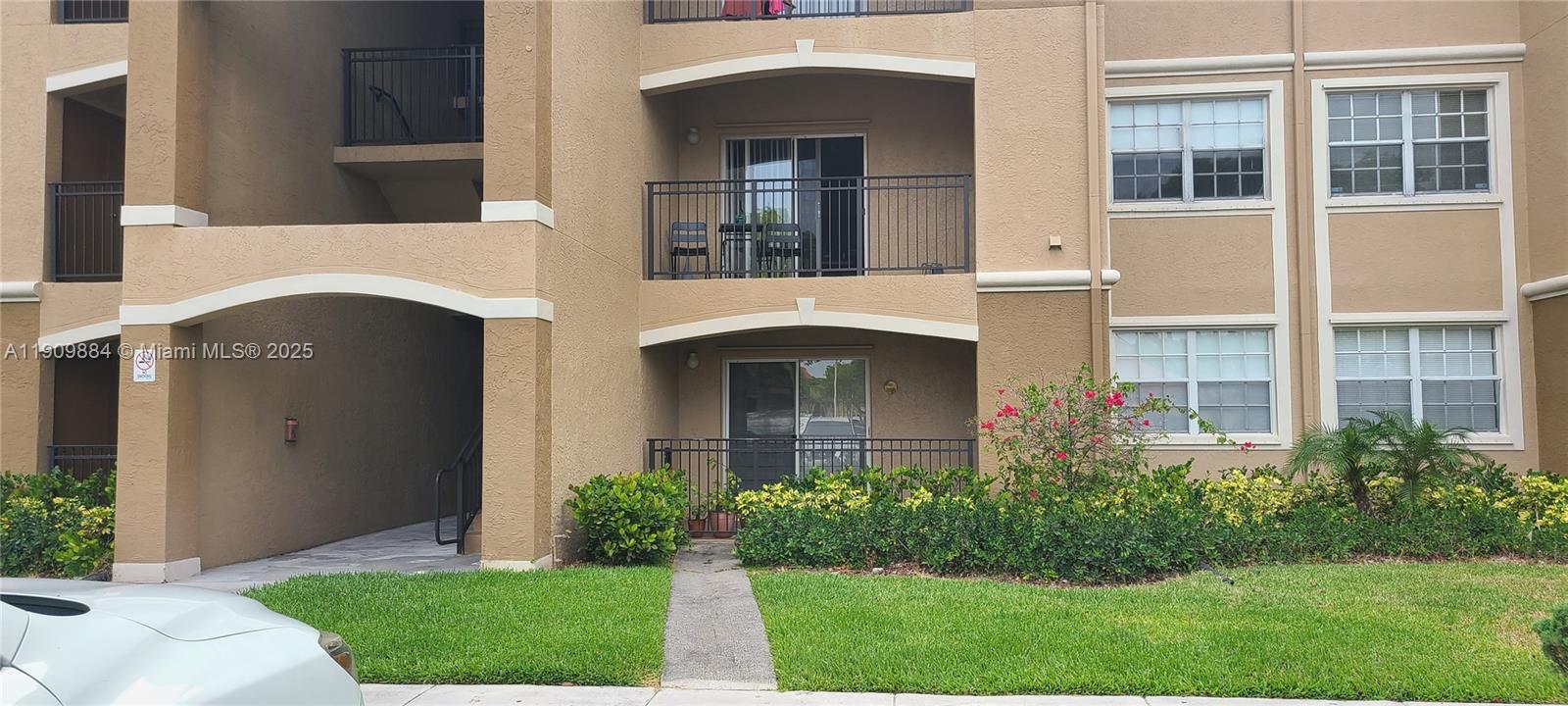 220 Southwest 116th Avenue, Unit 15103 Pembroke Pines, FL 33025 - Photo 40 of 51 a front view of a house with garden