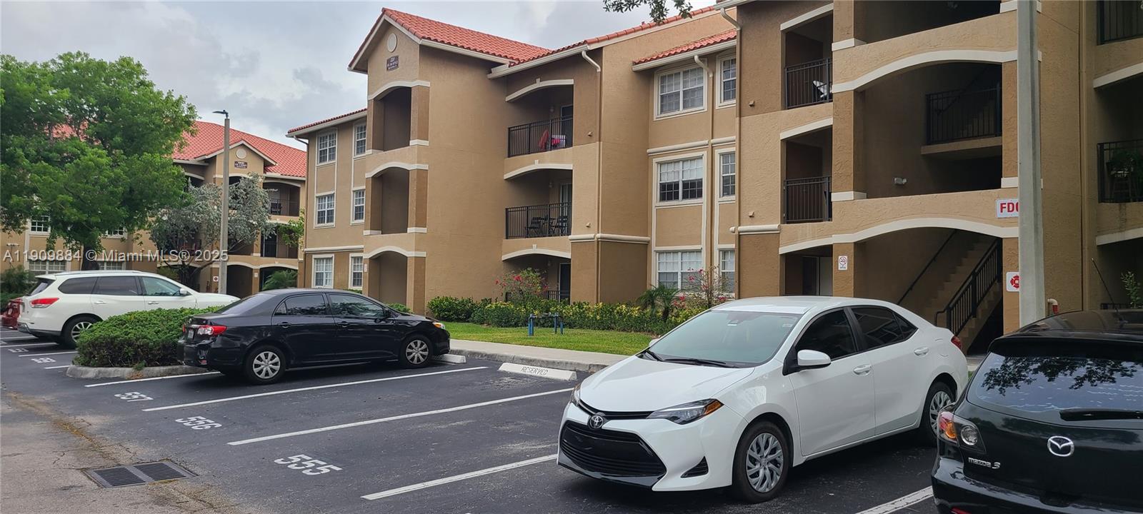 220 Southwest 116th Avenue, Unit 15103 Pembroke Pines, FL 33025 - Photo 43 of 51 a car parked in front of a house