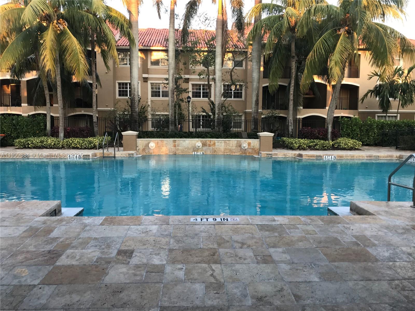 220 Southwest 116th Avenue, Unit 15103 Pembroke Pines, FL 33025 - Photo 47 of 51 a view of a swimming pool with a yard