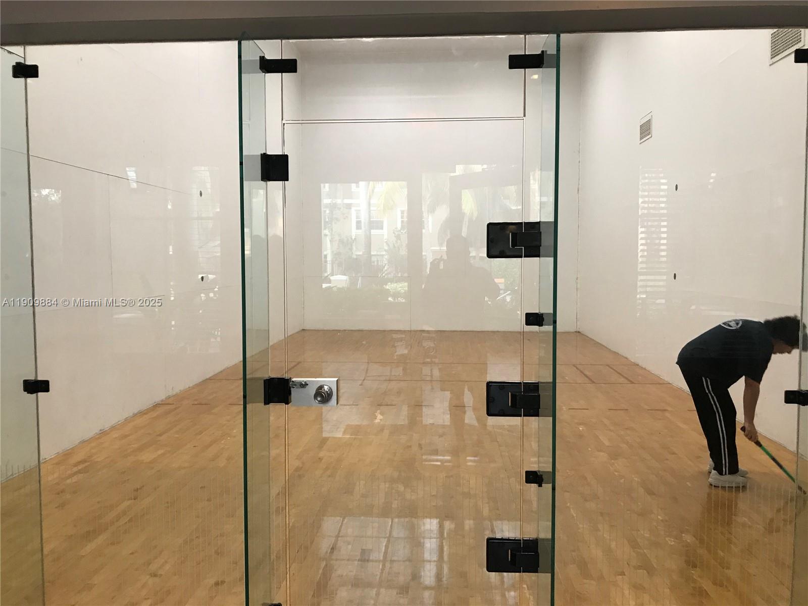 220 Southwest 116th Avenue, Unit 15103 Pembroke Pines, FL 33025 - Photo 48 of 51 a bathroom with a glass shower door