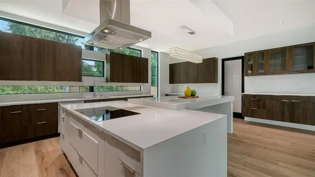 a kitchen with a stove a sink and a refrigerator