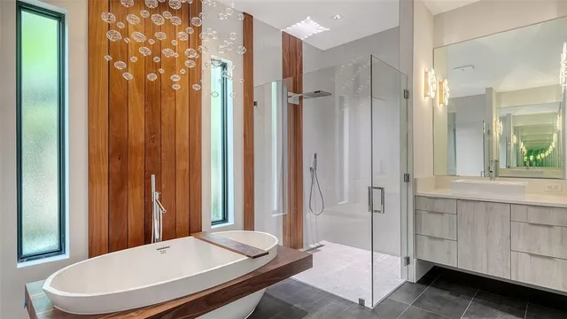 a bathroom with a bathtub and a shower