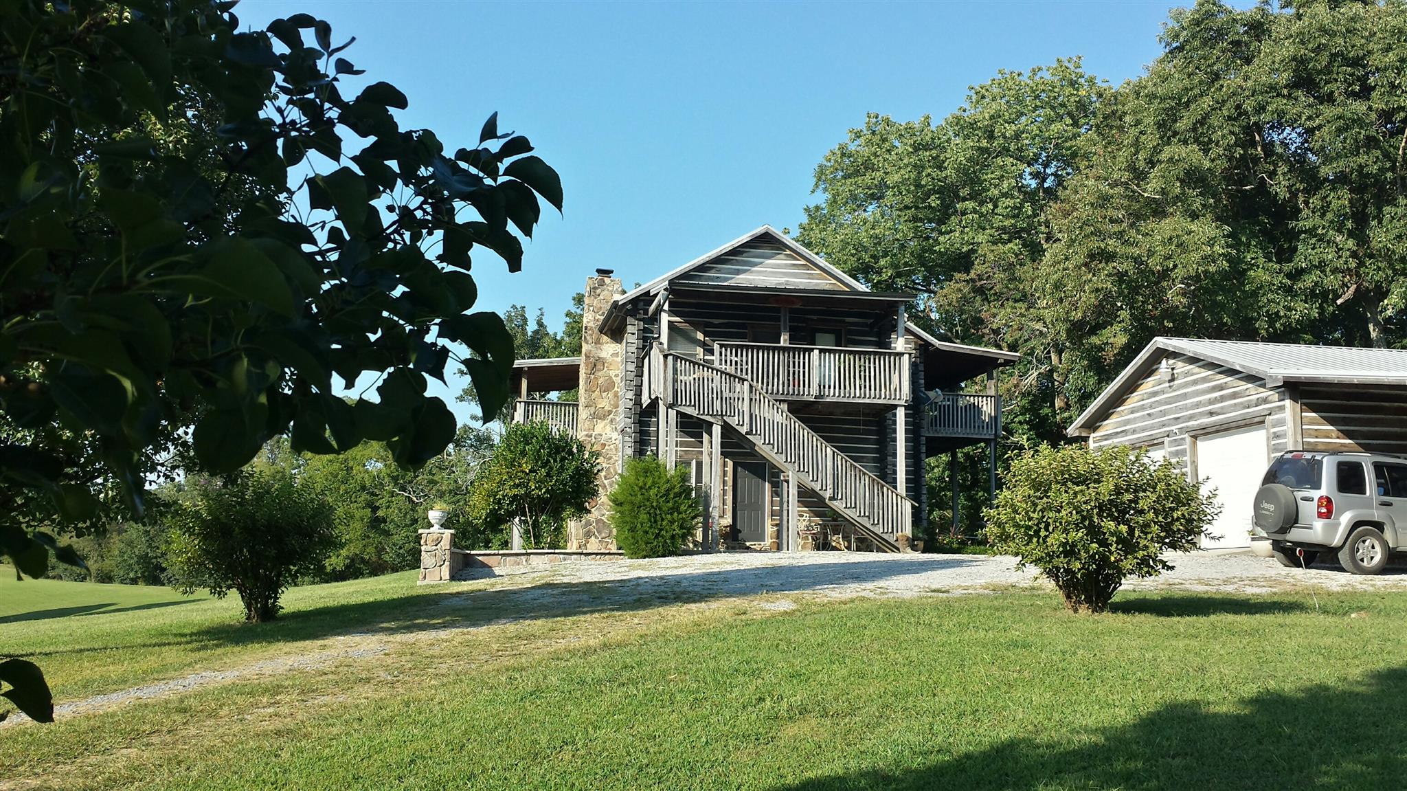555 Windy Ridge Wartrace, TN 37183 - Photo 1 of 23 Front view of this beautiful poplar log home with Sassafras decking and trim.
