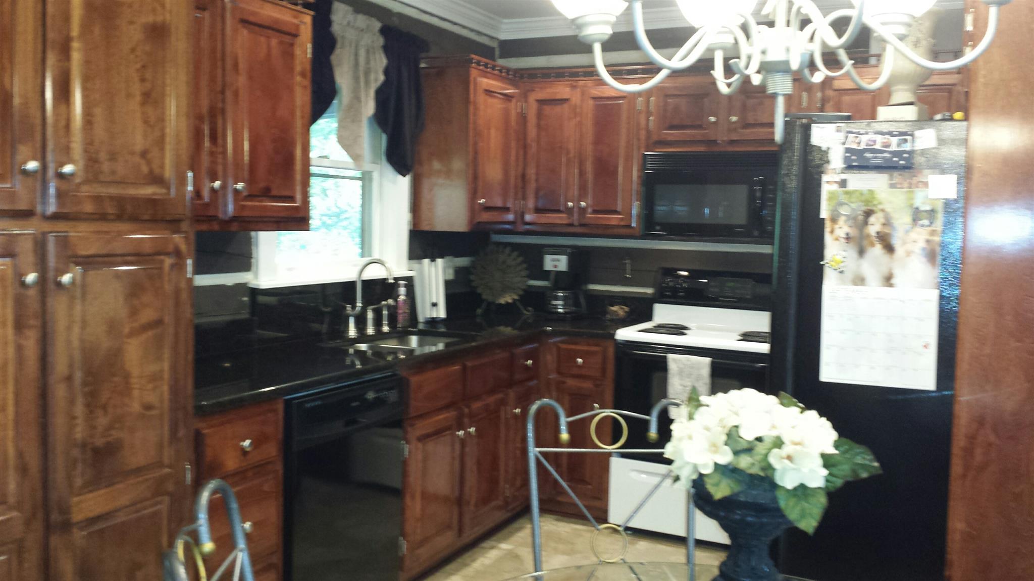 555 Windy Ridge Wartrace, TN 37183 - Photo 11 of 23 Upper level kitchen with cherry cabinets and granite counters.