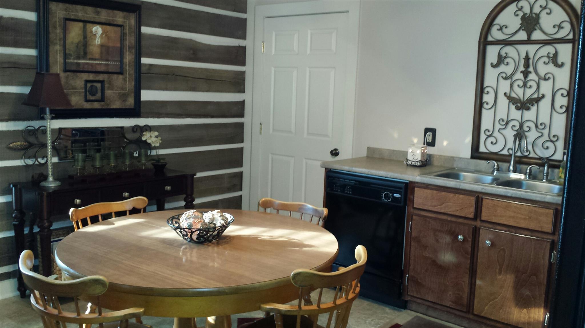 555 Windy Ridge Wartrace, TN 37183 - Photo 12 of 23 lower level kitchen with exposed log walls .