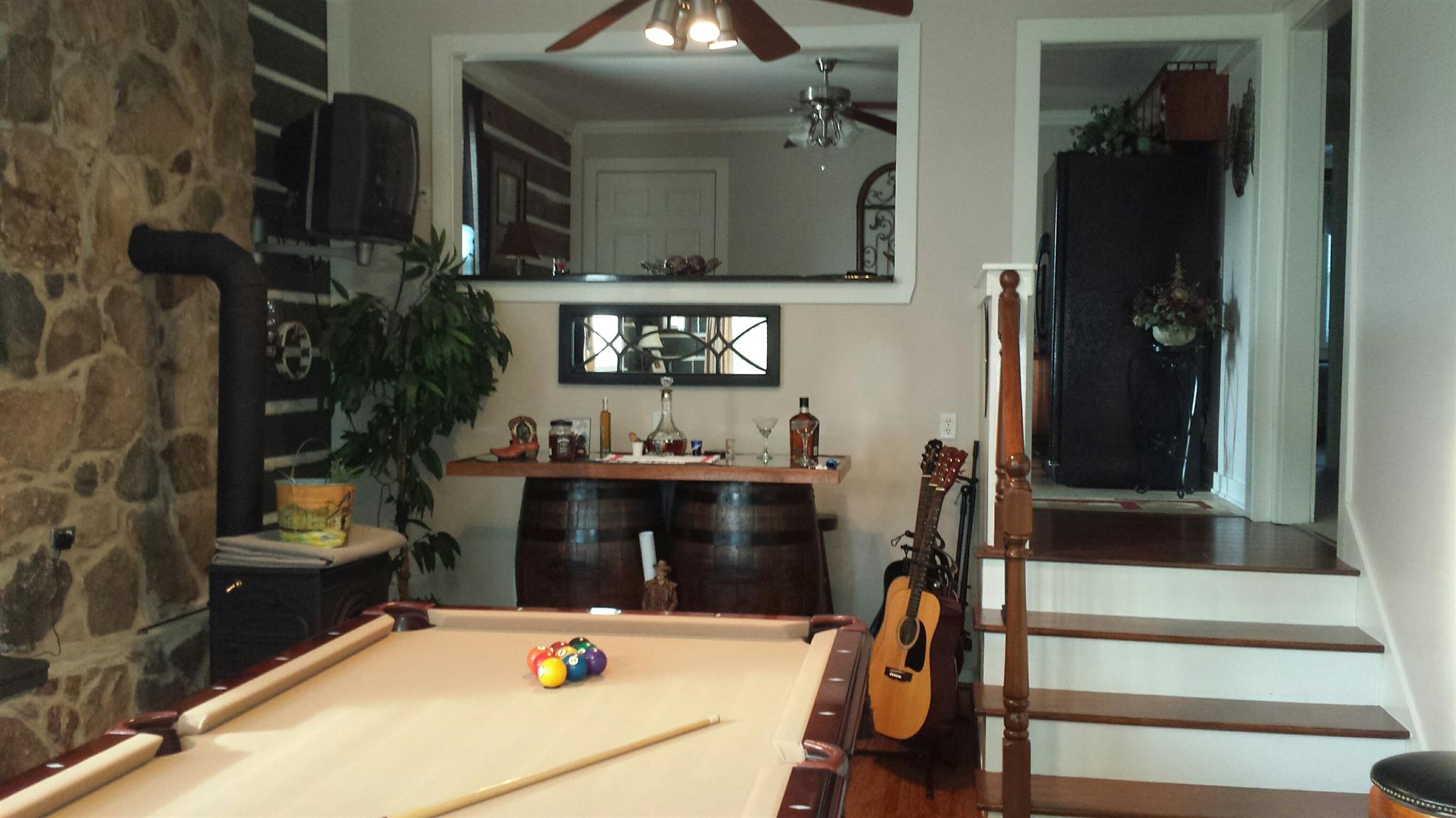 555 Windy Ridge Wartrace, TN 37183 - Photo 17 of 23 Lower level den with wall seating and wood burning stove.