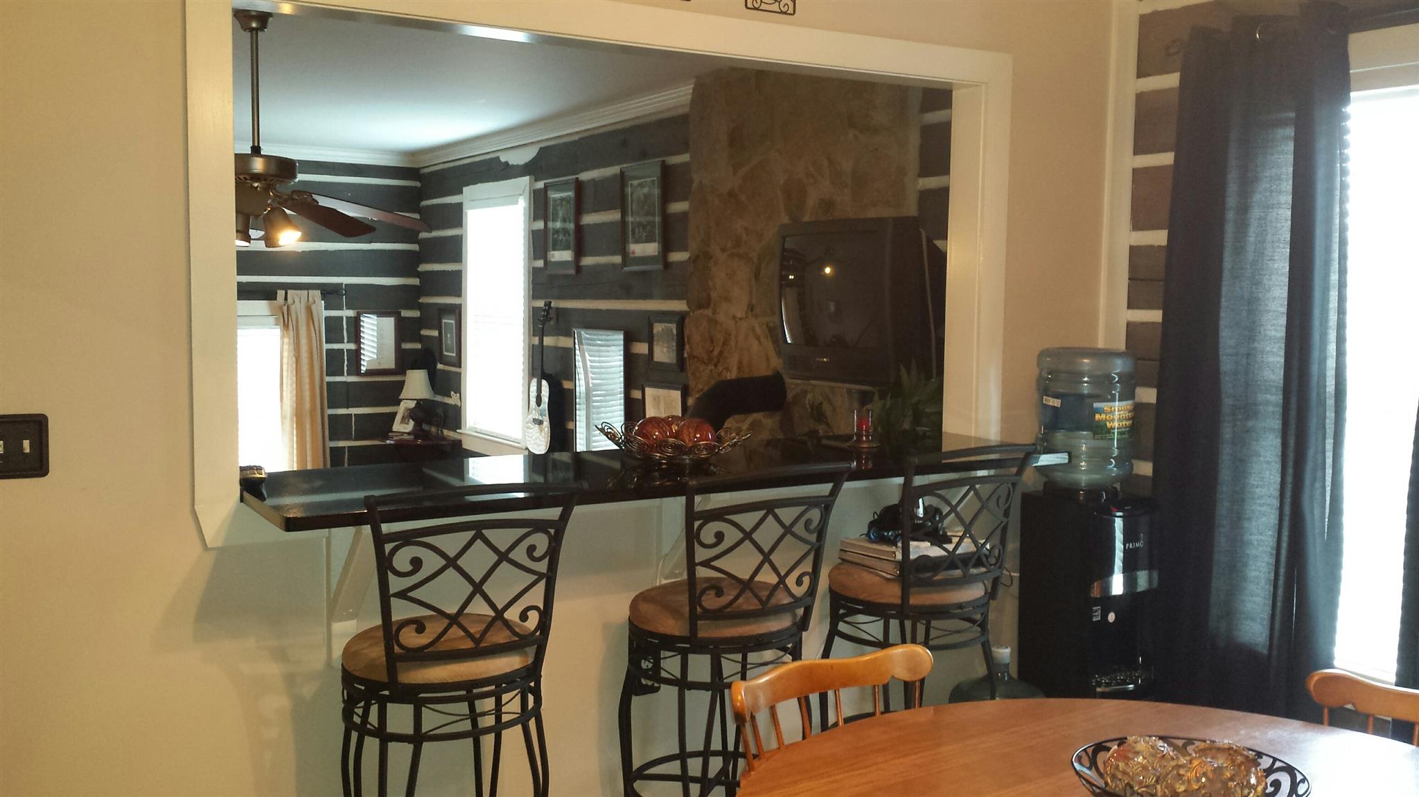 555 Windy Ridge Wartrace, TN 37183 - Photo 10 of 23 Bar seating looking from the lower level kitchen to the den/family room.