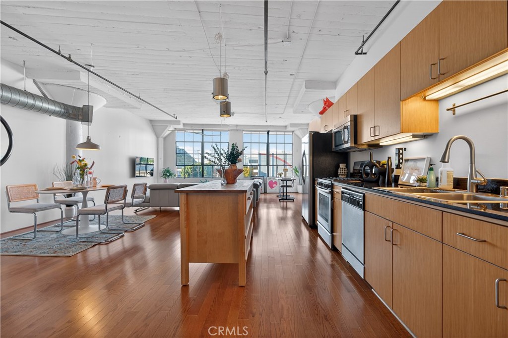 200 North San Fernando Road, Unit 315 Los Angeles, CA 90031 - Photo 14 of 42 a kitchen with lots of counter top space and wooden floor