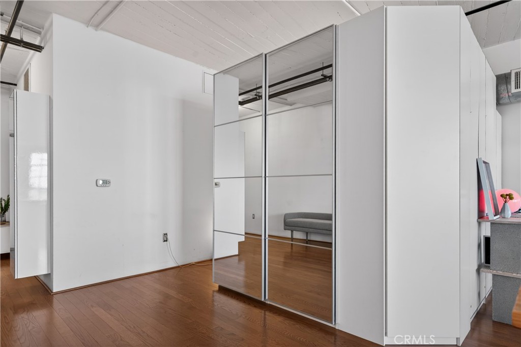 200 North San Fernando Road, Unit 315 Los Angeles, CA 90031 - Photo 18 of 42 a room with wooden floor and a ceiling fan