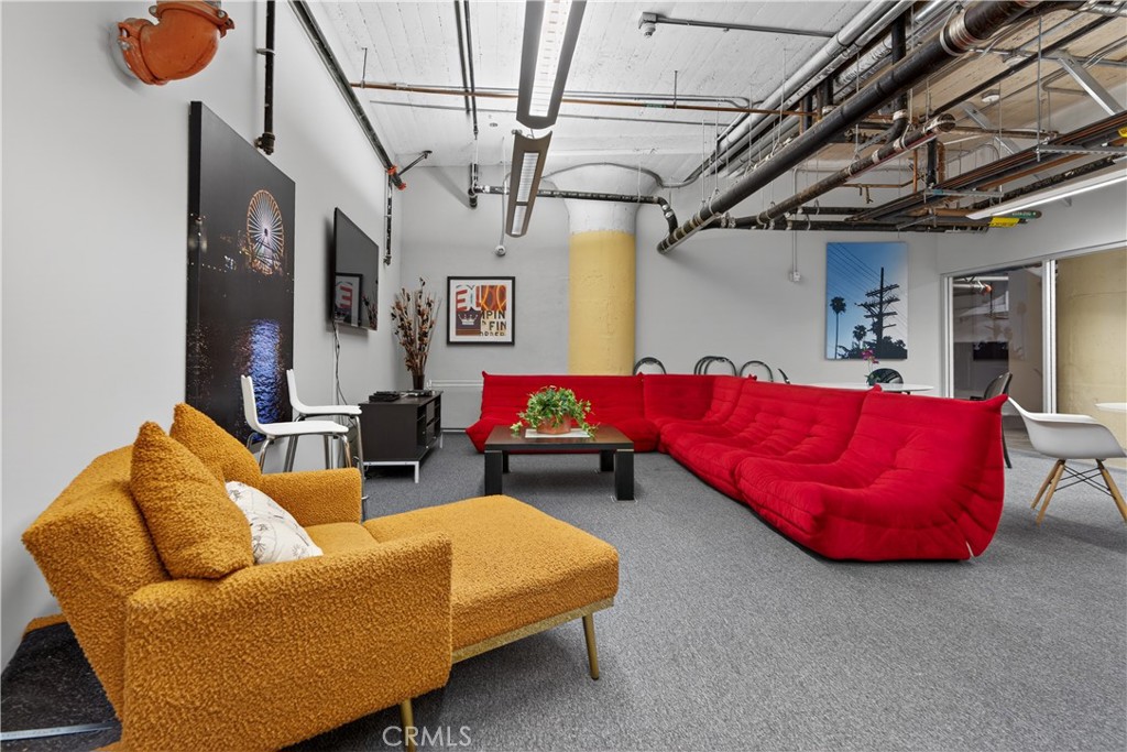 200 North San Fernando Road, Unit 315 Los Angeles, CA 90031 - Photo 35 of 42 a living room with furniture and a chandelier