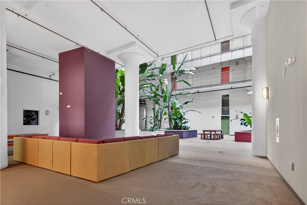 200 North San Fernando Road, Unit 315 Los Angeles, CA 90031 - Photo 39 of 42 a living room with stainless steel appliances kitchen island granite countertop furniture and a potted plant