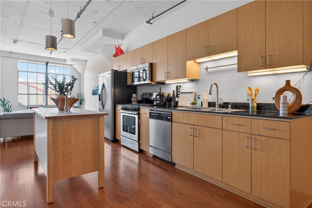 200 North San Fernando Road, Unit 315 Los Angeles, CA 90031 - Photo 4 of 42 a kitchen with stainless steel appliances granite countertop a sink stove and refrigerator