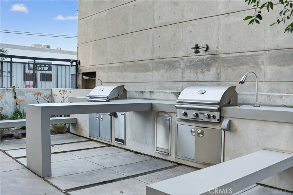 200 North San Fernando Road, Unit 315 Los Angeles, CA 90031 - Photo 41 of 42 a kitchen with kitchen island a stove a sink and a microwave