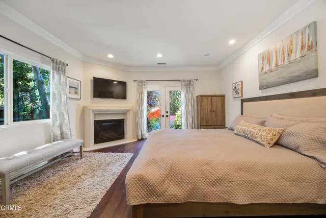 a bedroom with a bed and a desk