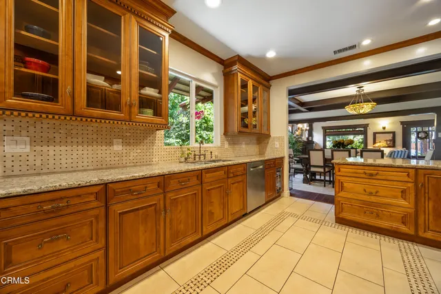 a spacious bedroom with a large bed and a fireplace