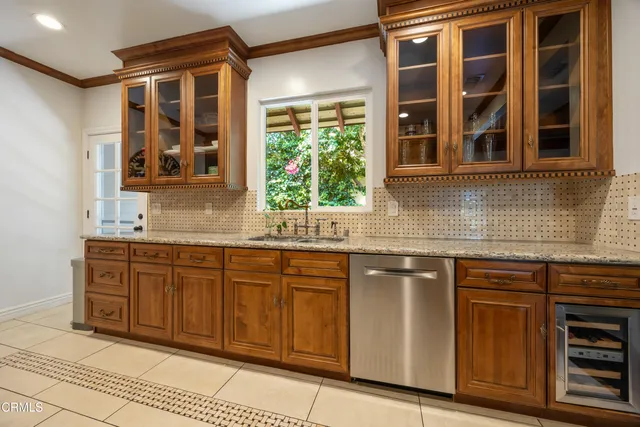 a spacious bathroom with a granite countertop sink a mirror and a shower
