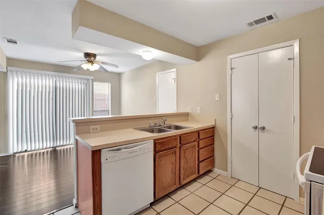 a kitchen with a stove and a refrigerator