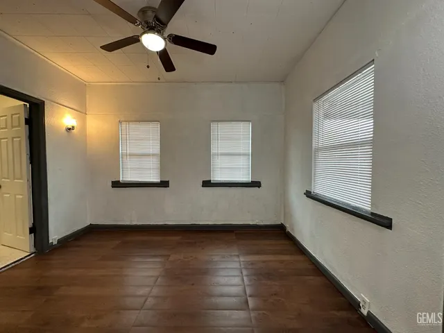 a view of room window and wooden floor