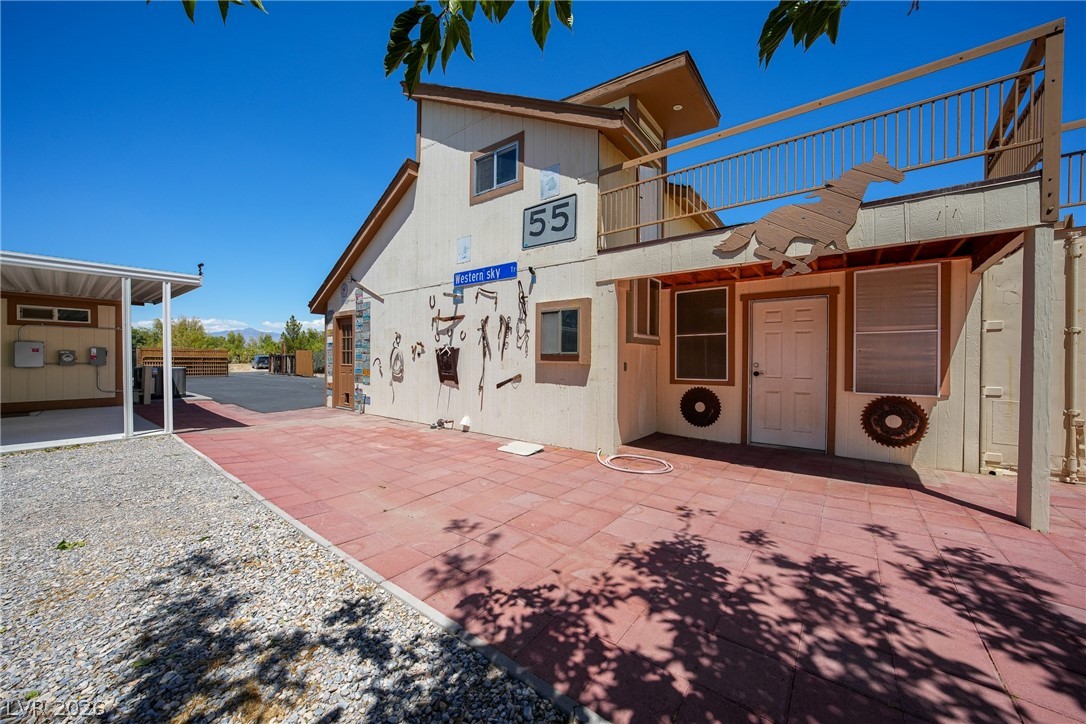 1831 West Horn Road Pahrump, NV 89048 - Photo 20 of 59 An inviting courtyard with an attached second-story balcony extends a warm welcome.