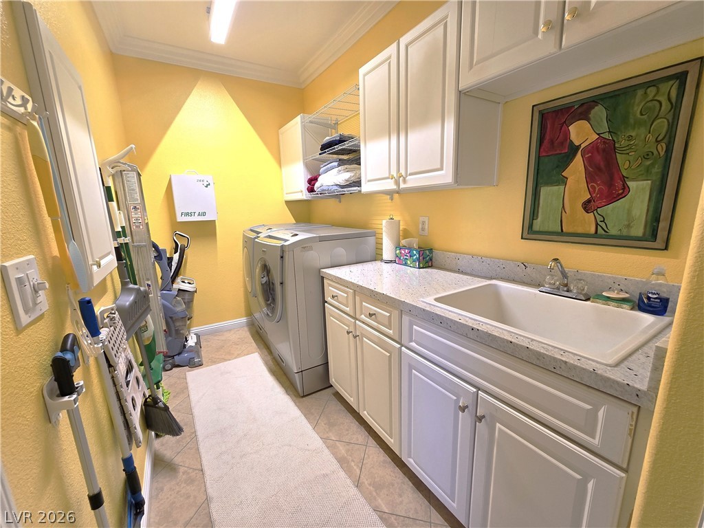 2050 West Warm Springs Road, Unit 2422 Henderson, NV 89014 - Photo 14 of 44 This dedicated utility space offers seamless organization and functional design.