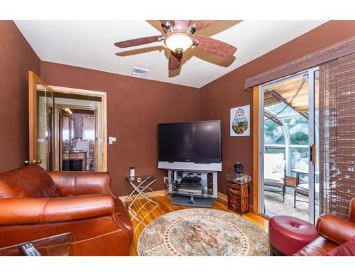 36 Howard Road Medford, MA 02155 - Photo 17 of 39 a living room with furniture and a flat screen tv