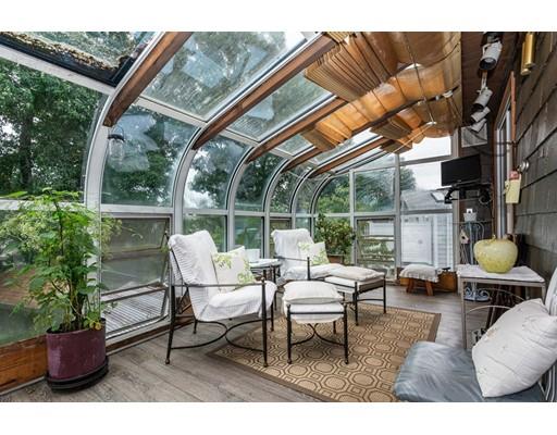 36 Howard Road Medford, MA 02155 - Photo 21 of 39 a view of a patio with a table chairs and a potted plant