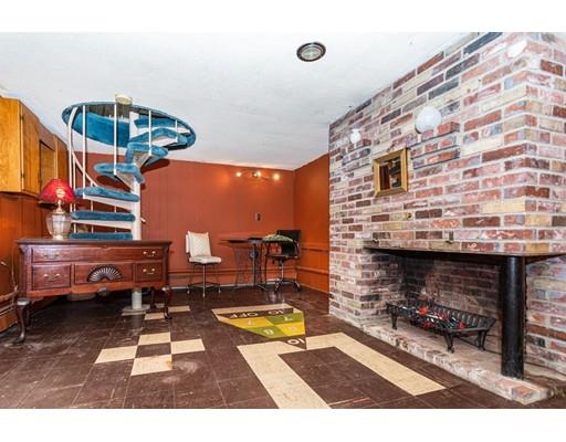 36 Howard Road Medford, MA 02155 - Photo 29 of 39 a living room with furniture and a fireplace