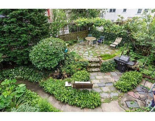 36 Howard Road Medford, MA 02155 - Photo 37 of 39 a view of a garden with a bench