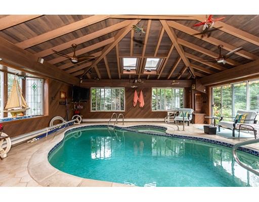 36 Howard Road Medford, MA 02155 - Photo 6 of 39 a swimming pool with outdoor seating and yard