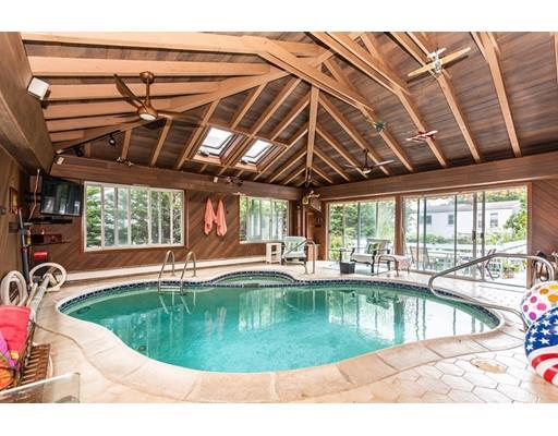 36 Howard Road Medford, MA 02155 - Photo 7 of 39 a view of a swimming pool with a patio