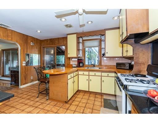 36 Howard Road Medford, MA 02155 - Photo 10 of 39 a kitchen with a sink a stove a refrigerator and cabinets