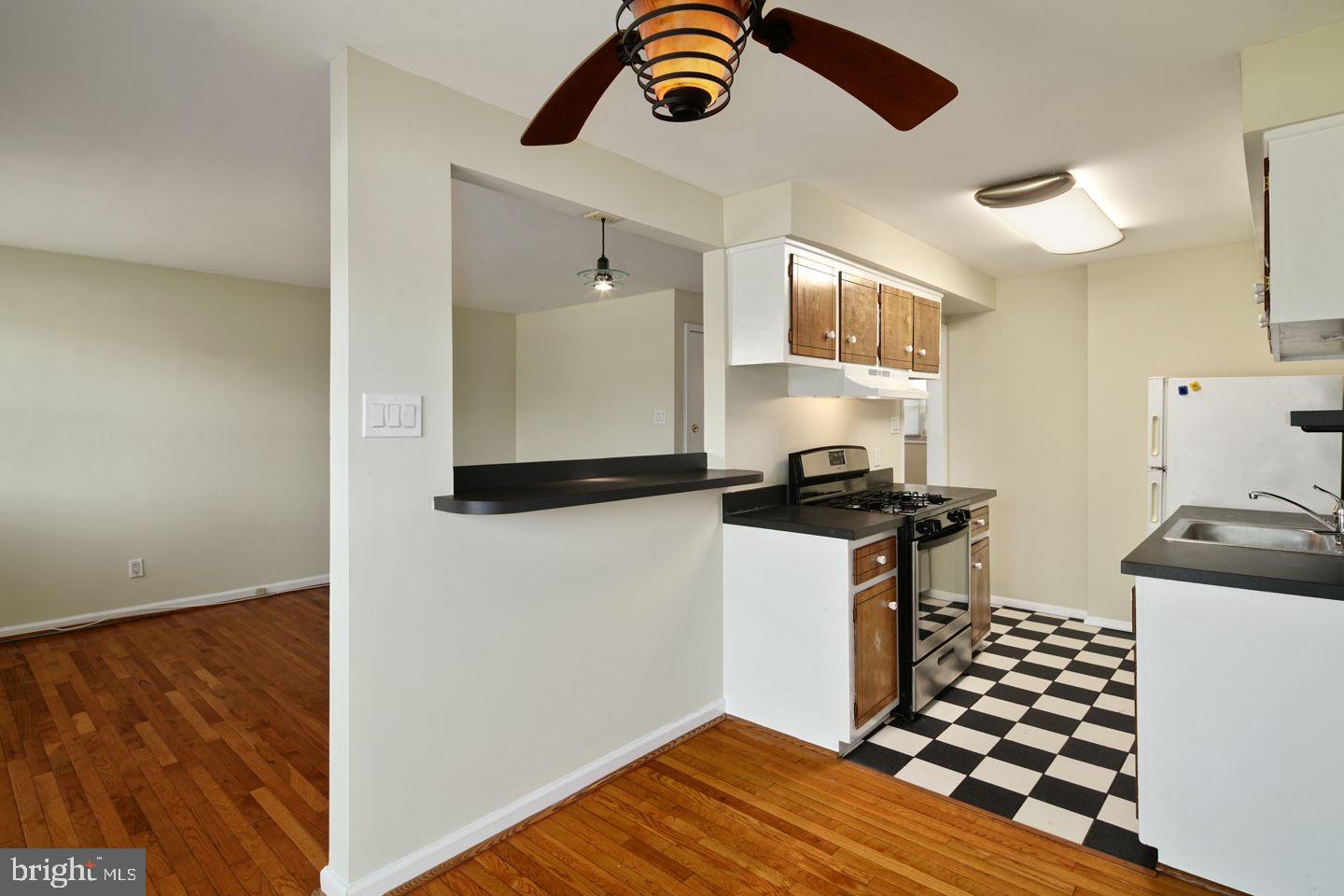 3400 Ashfield Lane, Unit 1 Philadelphia, PA 19114 - Photo 11 of 18 a kitchen with a sink and a stove top oven