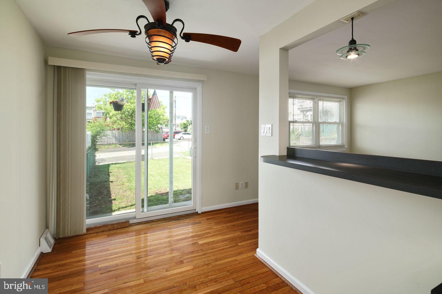 3400 Ashfield Lane, Unit 1 Philadelphia, PA 19114 - Photo 12 of 18 a view of an empty room with wooden floor and a window