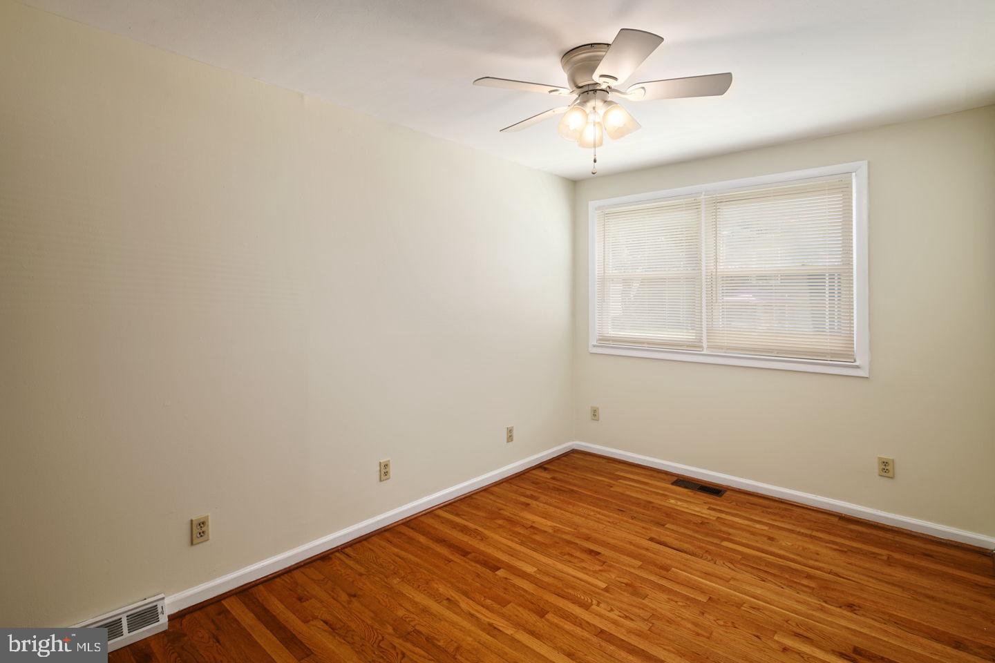 3400 Ashfield Lane, Unit 1 Philadelphia, PA 19114 - Photo 15 of 18 a view of a room with wooden floor and a ceiling fan