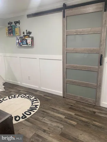 a view of kitchen with cabinets and wooden floor