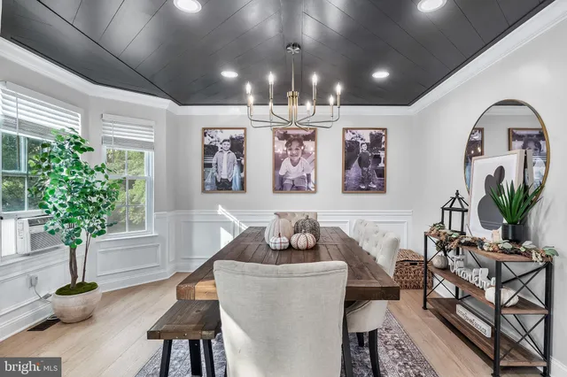 a living room with furniture and potted plant