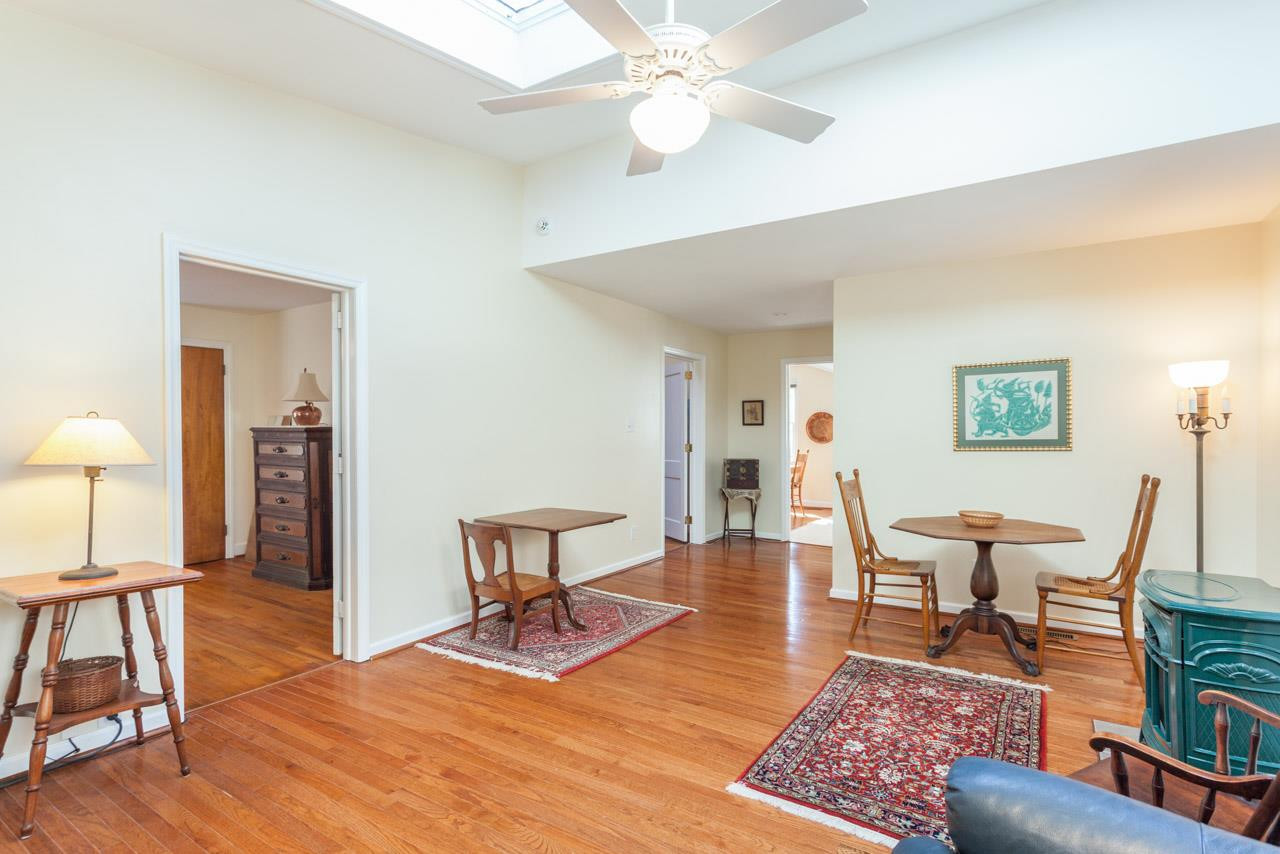 1306 Courtland Drive Raleigh, NC 27604 - Photo 12 of 22 Looking back to the kitchen from the other end of the family room you can get another perspective of the size of this room.