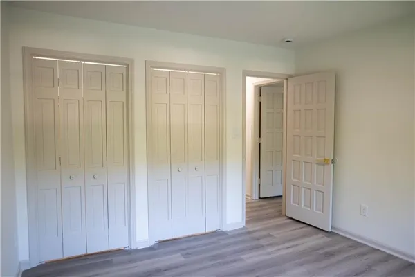 an empty room with wooden floor