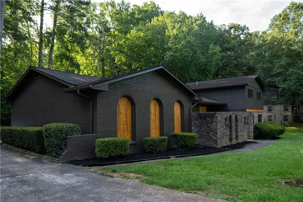 a front view of a house with garden