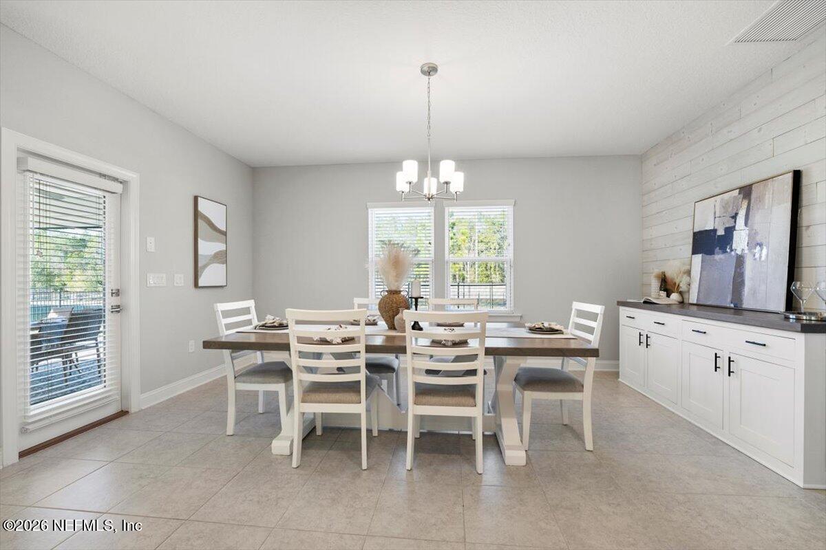 219 Morning Mist Lane St. Johns, FL 32259 - Photo 13 of 81 a view of a dining room with furniture and window