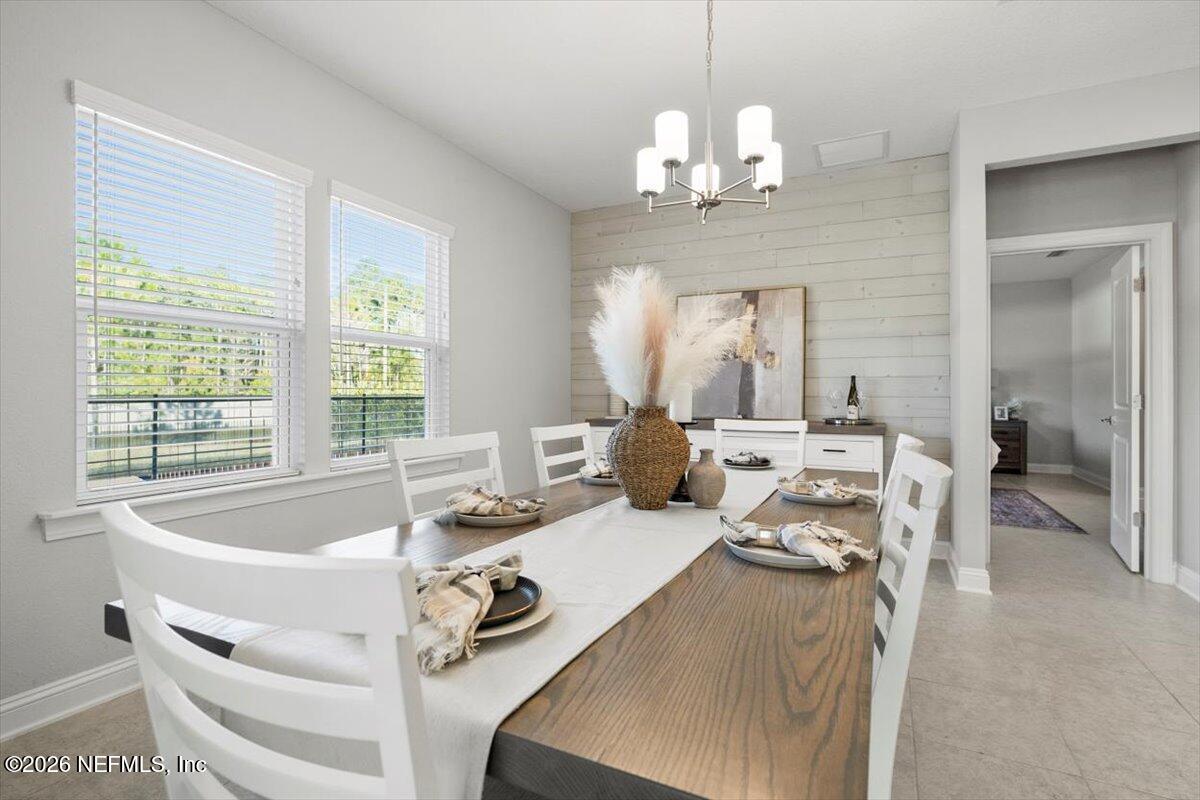 219 Morning Mist Lane St. Johns, FL 32259 - Photo 14 of 81 a living room with furniture and a chandelier