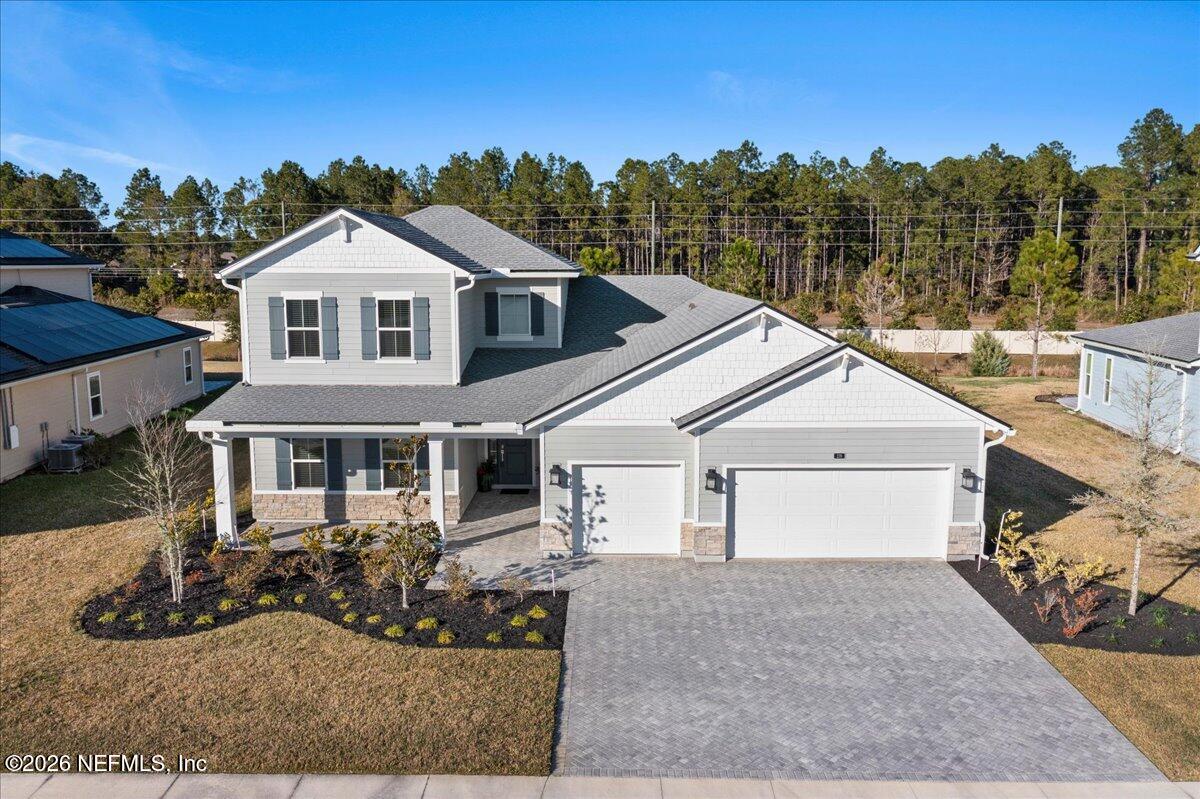 219 Morning Mist Lane St. Johns, FL 32259 - Photo 3 of 81 a front view of a house with a yard