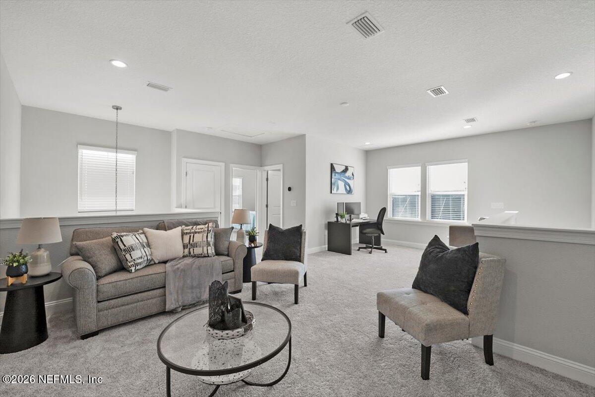 219 Morning Mist Lane St. Johns, FL 32259 - Photo 35 of 81 a living room with furniture and a large window