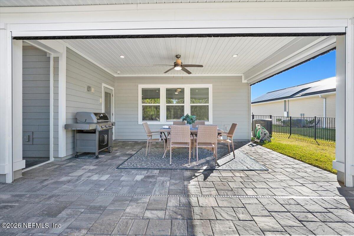 219 Morning Mist Lane St. Johns, FL 32259 - Photo 43 of 81 a living room with a large window and chairs